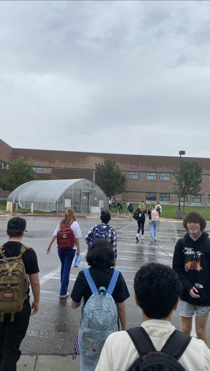 Rocky students walk around campus in the rain.