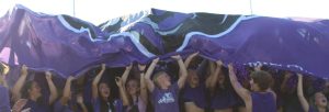 Rocky Students holding the flag after a touchdown.