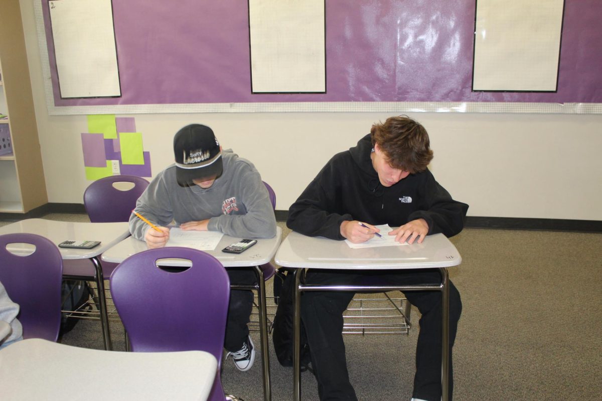 Freshman, Tucker Coats and James Mize working on a math worksheet in advisory