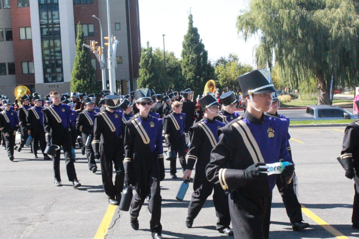 Marching Band pictured walking after visual warmup