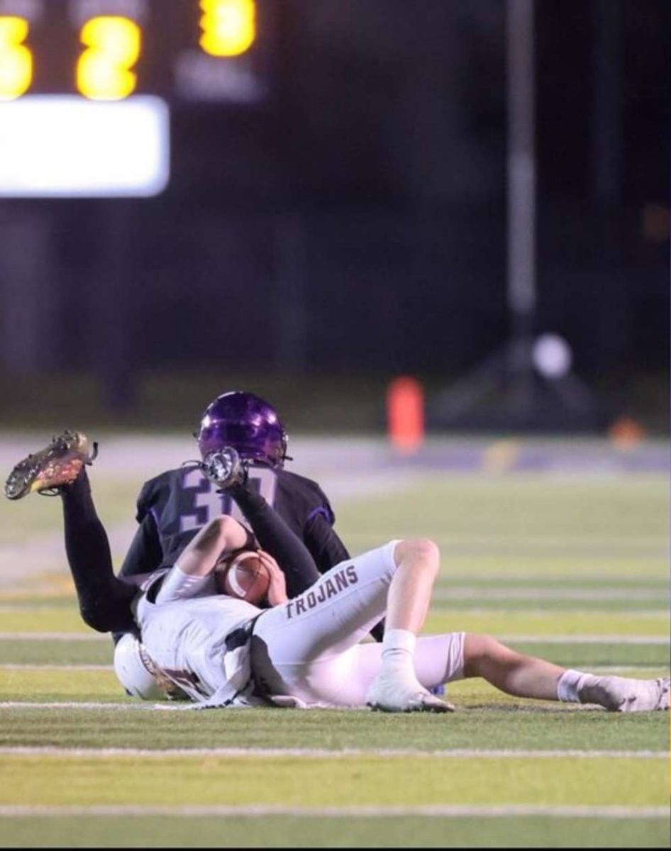 Owen making a tackle during the Rocky vs Rigby football game