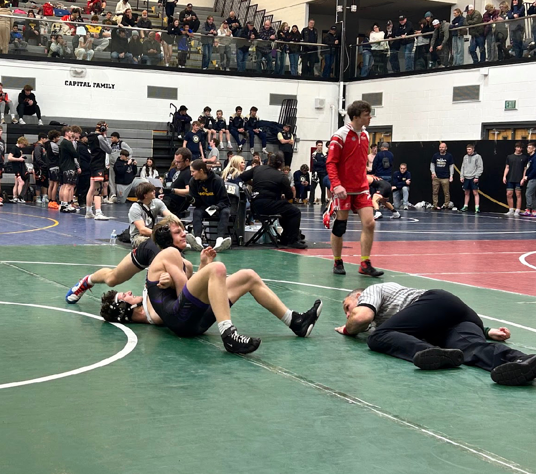 Nate Galloway pins his opponent