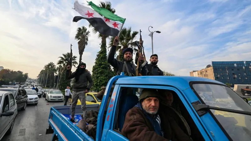 Syrian rebel fighters and their supporters celebrated after entering Damascus with no resistance on Sunday