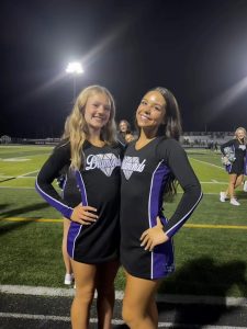 Head Captain Ava Allen with her "little" on the sidelines at a football game.