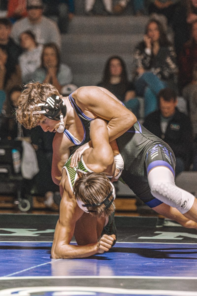 Rockys Grant Brown struggles with a Eagle wrestler during his duel.