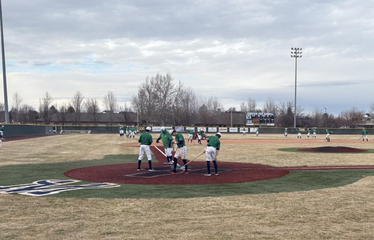 Rocky Mountain baseball team preps the baseball field and warms up to play mountain view Mavric's on March 12th
