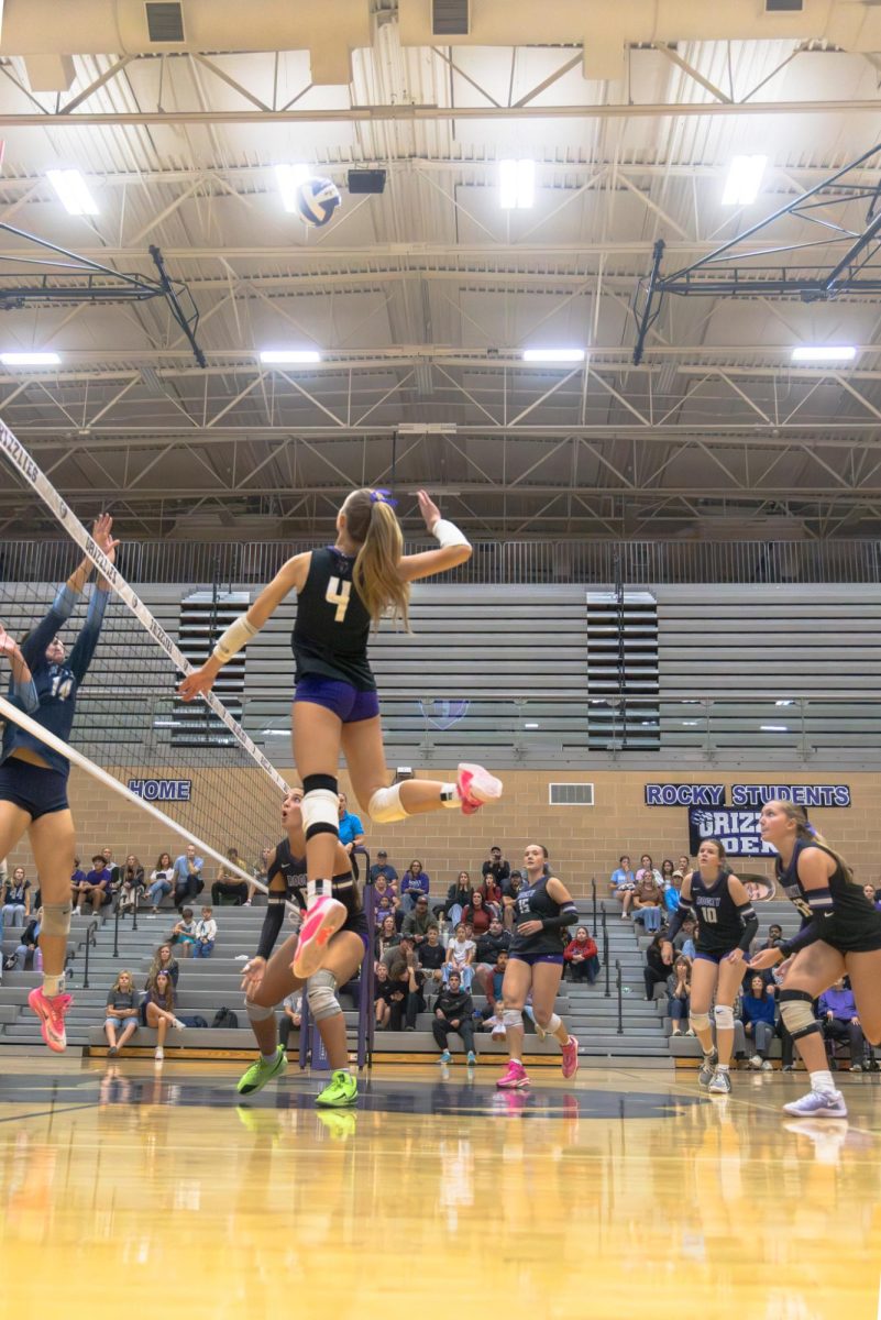 Allie Chandler spiking the ball against volleyball vs. Skyview