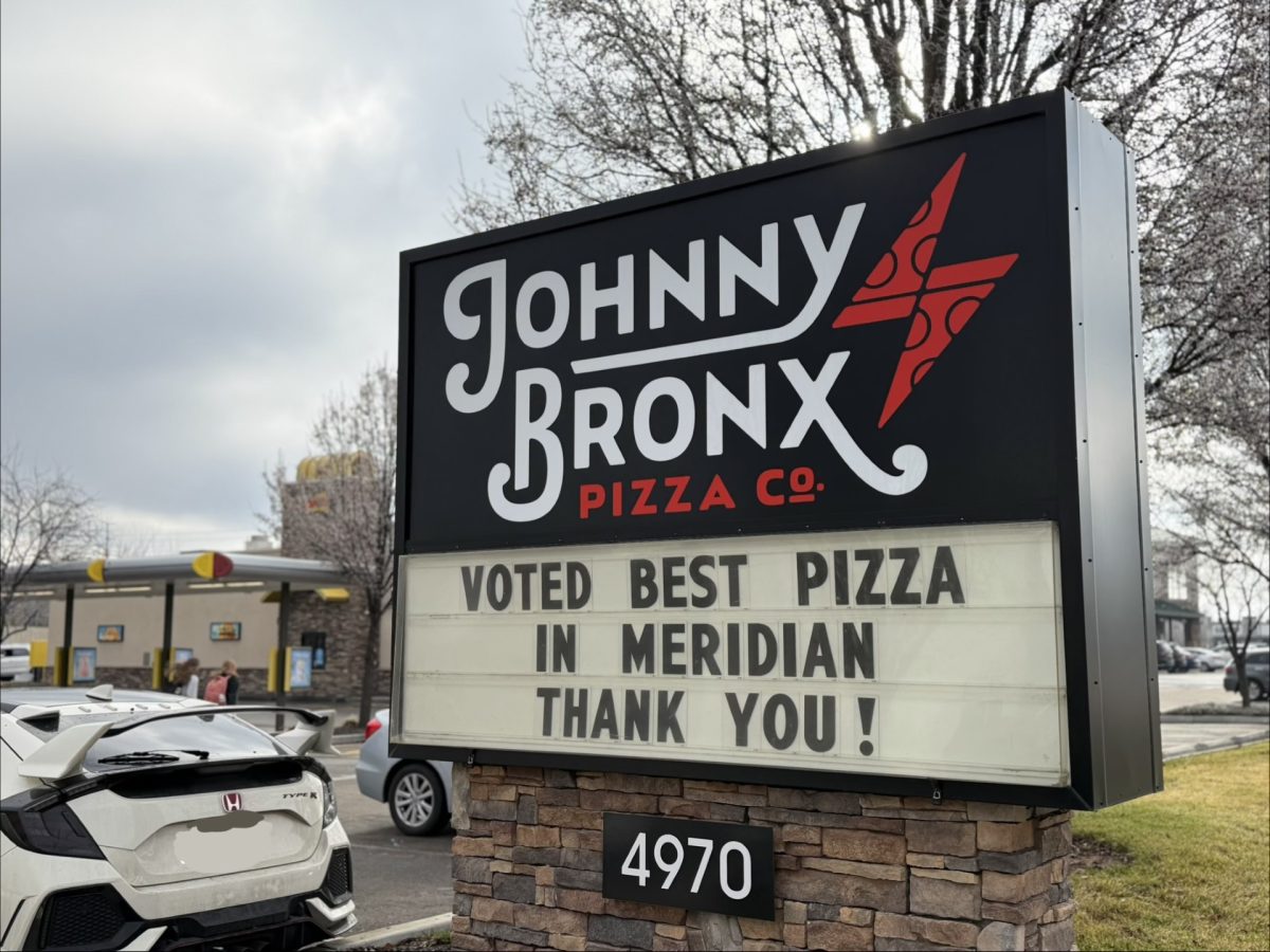 A photo of a Johnny Bronx sign, reading "Voted best pizza in meridian thank you!"