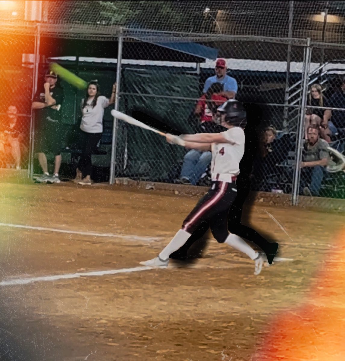 Lindy Kenyon, a 9th grader at Rocky, swinging for her club team