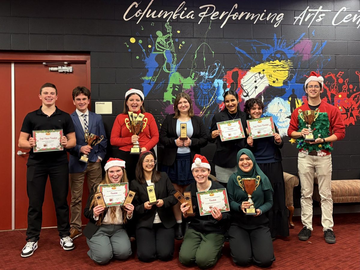 Speech and Debate Team celebrating their wins at Columbia High School 

Logan Otto, Jason “Porter” Clark, Samantha Clark, Taylor Sandy, Chitra Verma, Josie Bobodzhanov, Mr. Rambeau, Rosie Hines, Emma Atkinson, Luci Dean, Hafsah Mohammed 
Photographer: Emma Atkinson