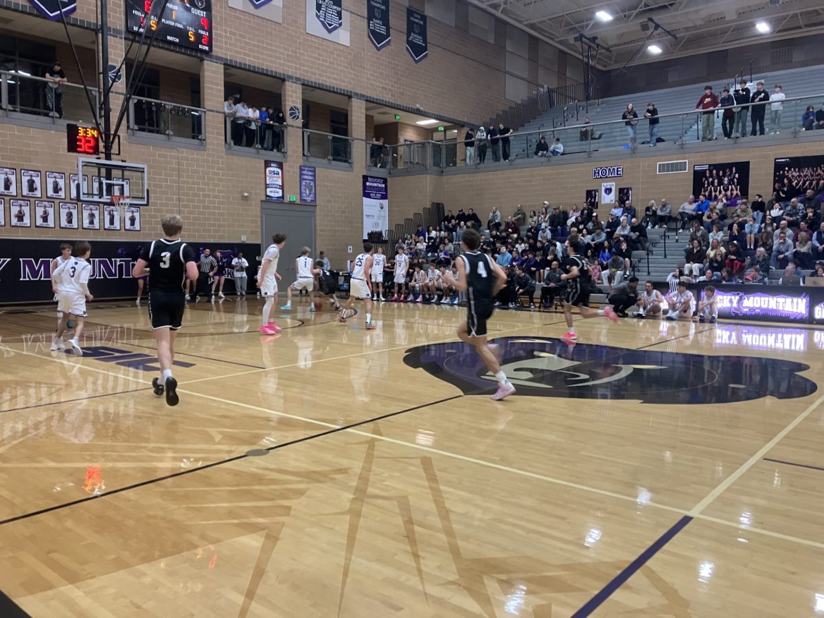 Packed gym, tight score, and all the energy of a Friday‑night showdown as Rocky Mountain battles to close the gap.
