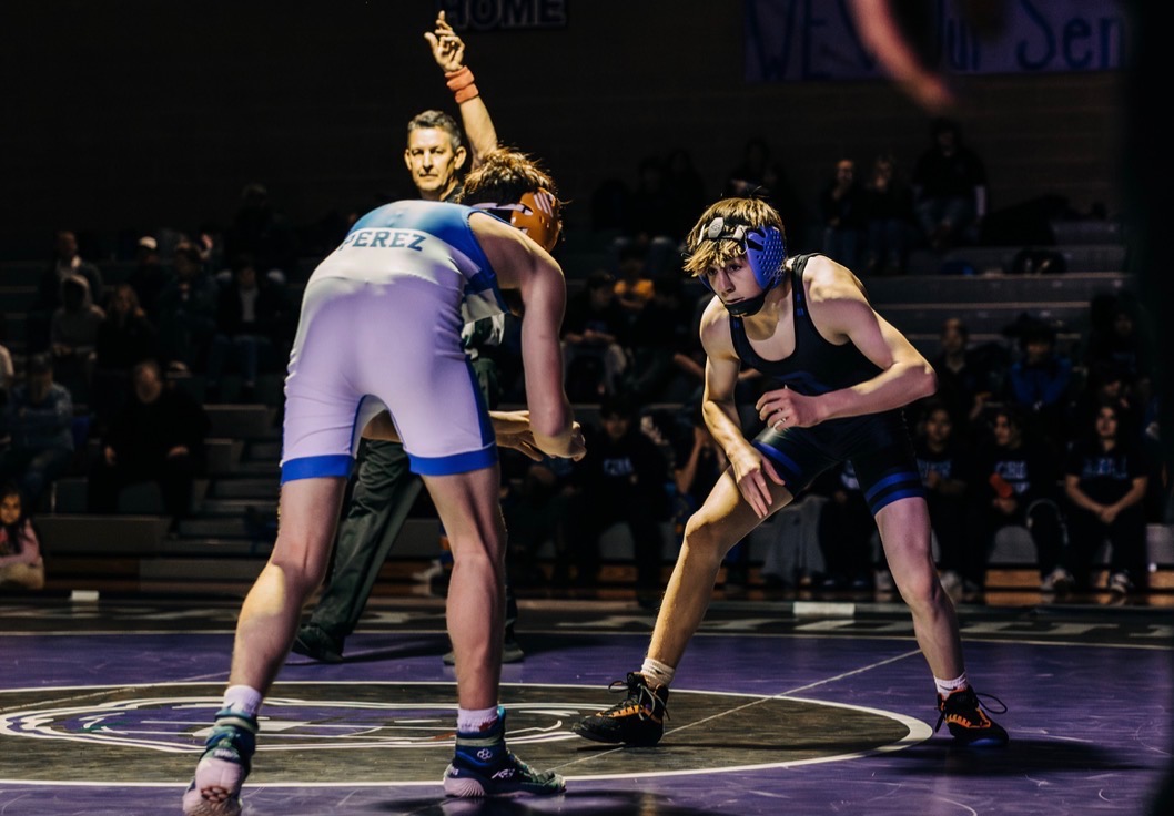 A picture of Sawyer Lindley (right) in a wrestling match. Image by Cody Lindley
