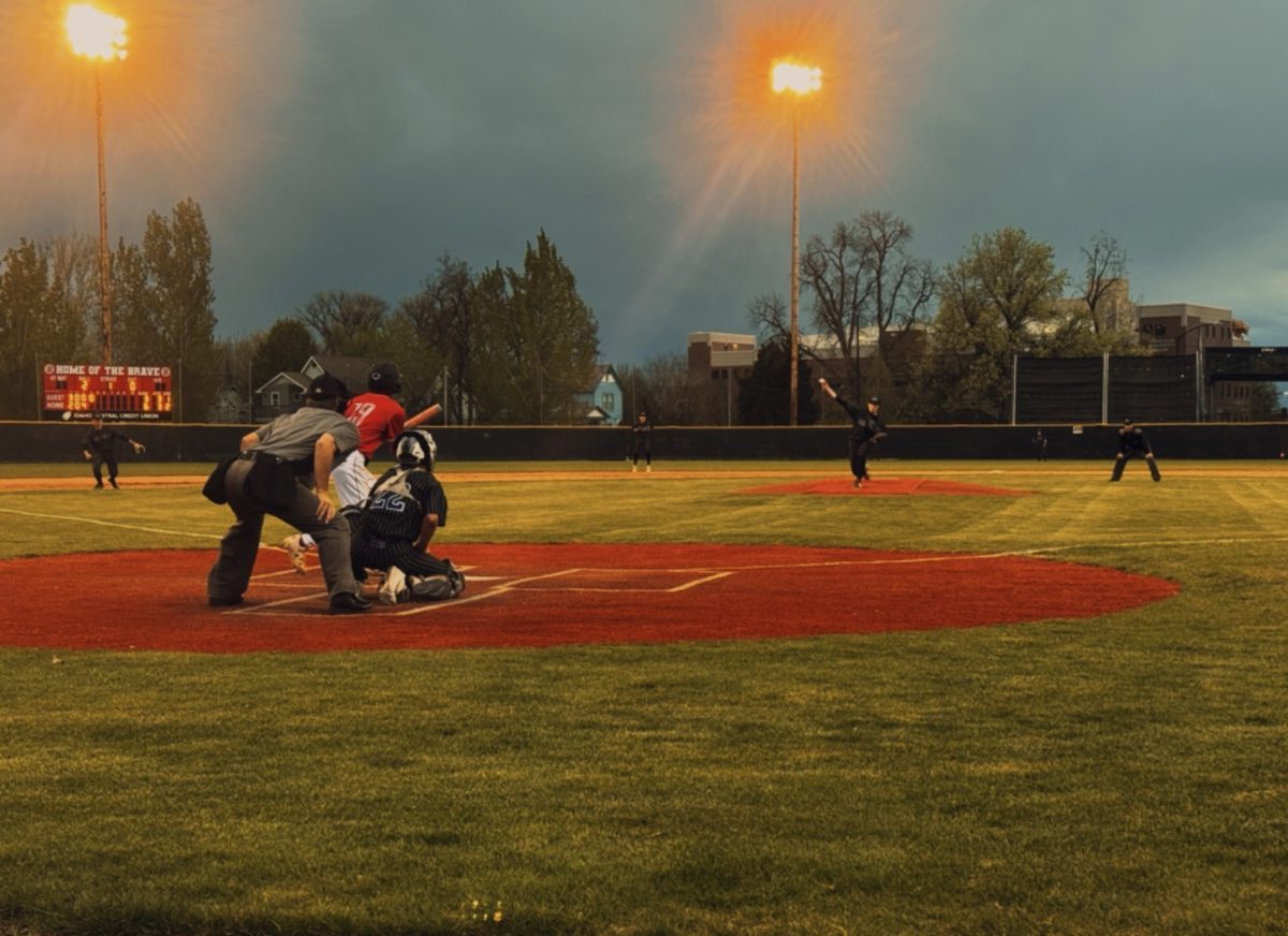 Rocky Mountain pitcher Taylor Porter pitching on the mound in the 4th inning to a Boise hitter.