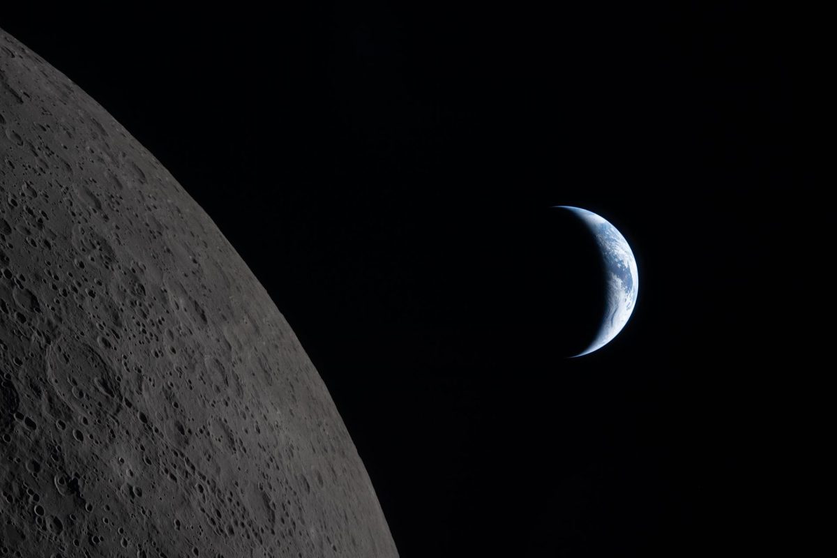 "The Edge of Two Worlds". Our planet draws closer to passing behind the Moon in this image captured by the Artemis II crew during their lunar flyby. Earth is in a crescent phase, with sunlight coming from the right. The dark portion of Earth is experiencing nighttime.